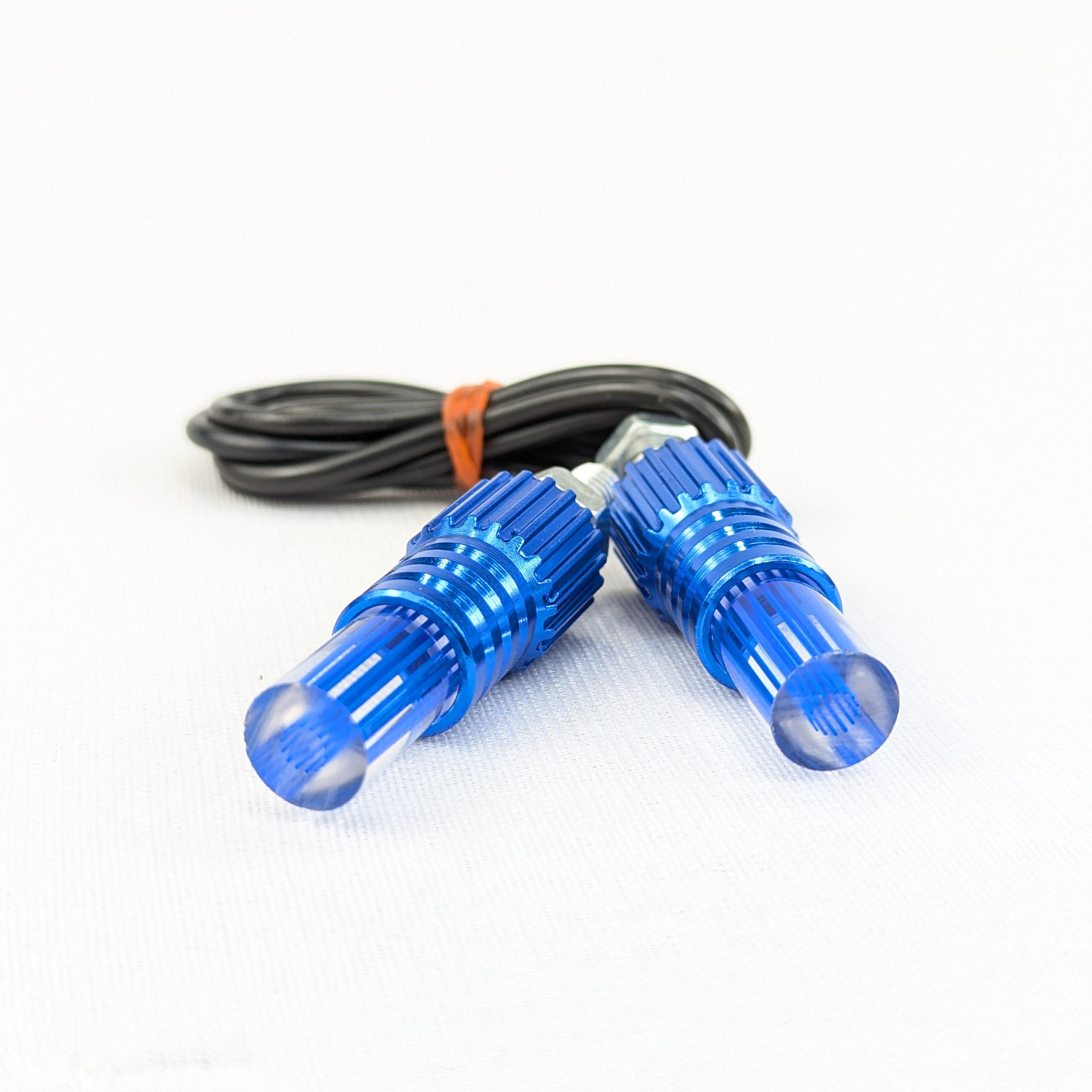 Two blue LED lights with a cable on a white background