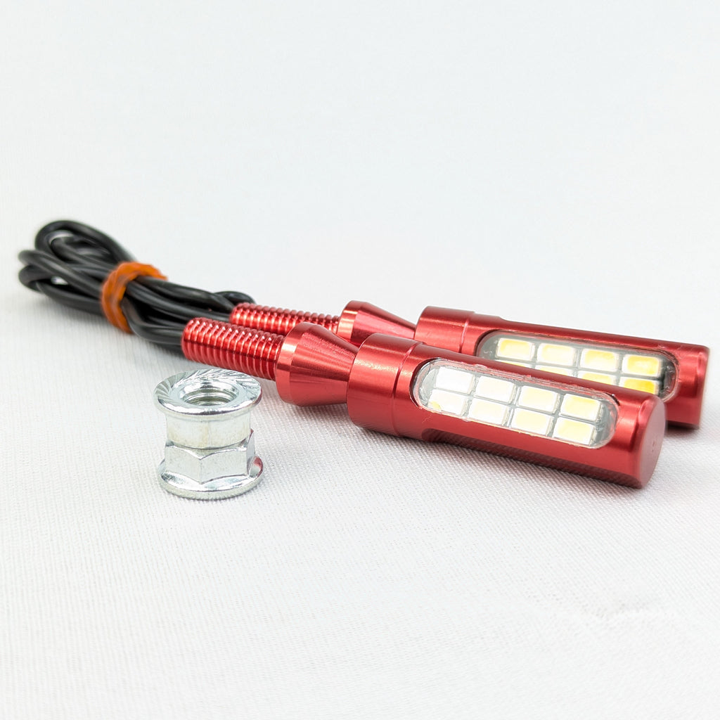 Red LED light bulbs with wiring on a white background