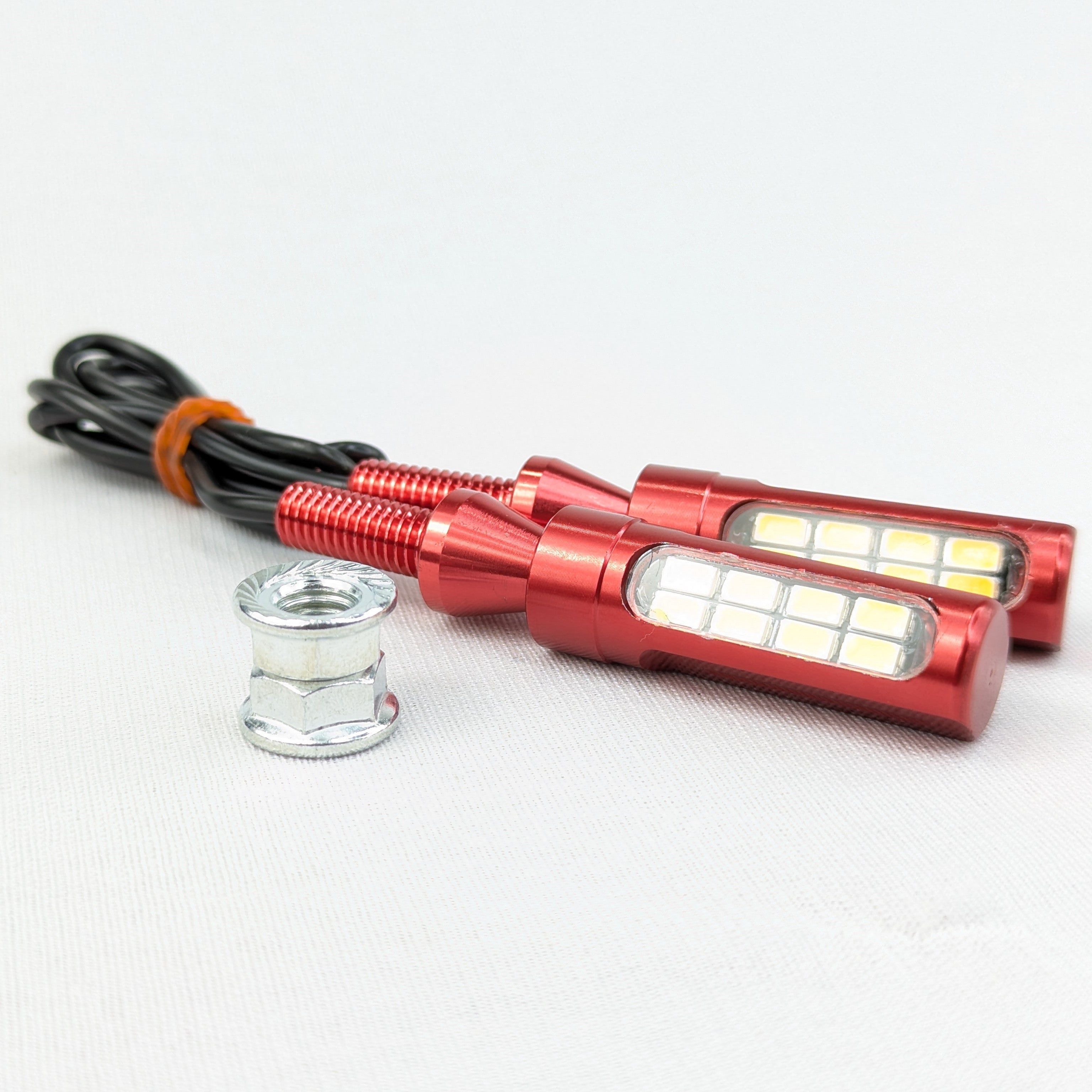 Red LED light bulbs with wiring on a white background