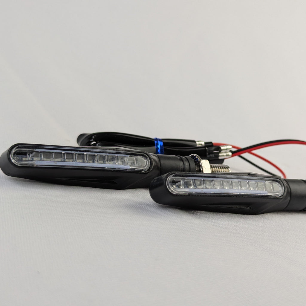 Two LED lights with wiring on a gray background