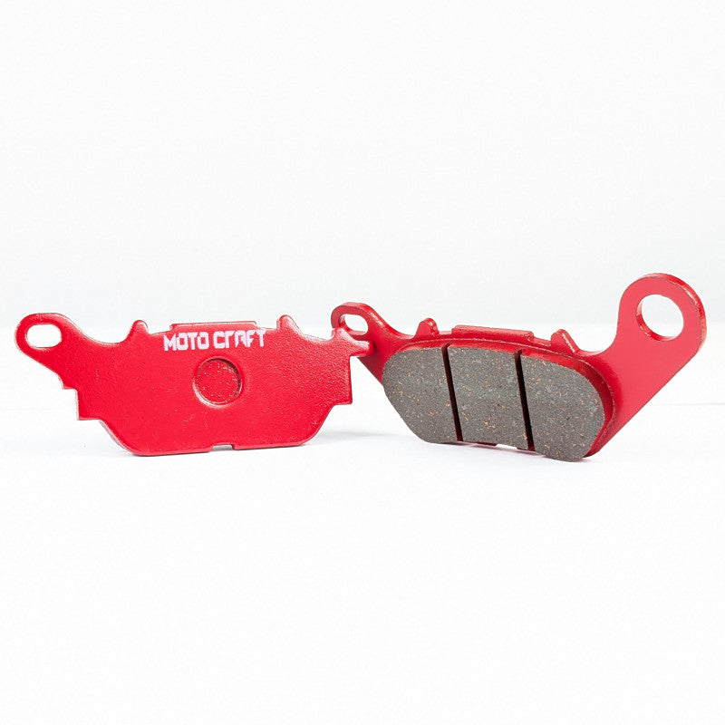 Red brake pads with 'Moto Craft' branding on a white background