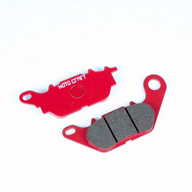 Red brake pads with gray inserts on a white background, featuring the 'Moto Craft' brand.