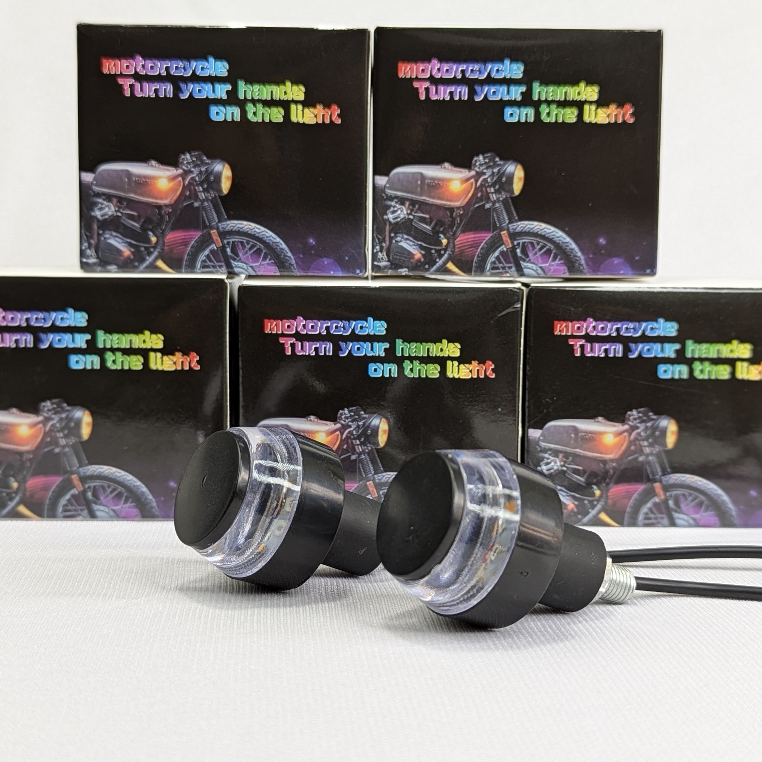 Motorcycle turn signal indicators with packaging in the background