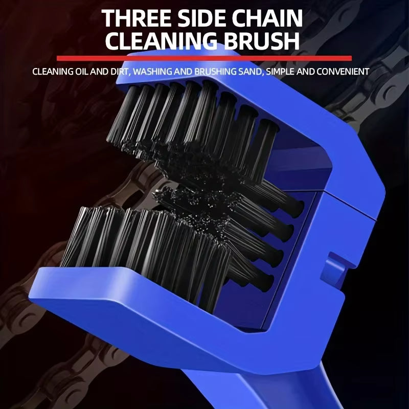 Three-sided chain cleaning brush with blue handle and black bristles on a dark background.
