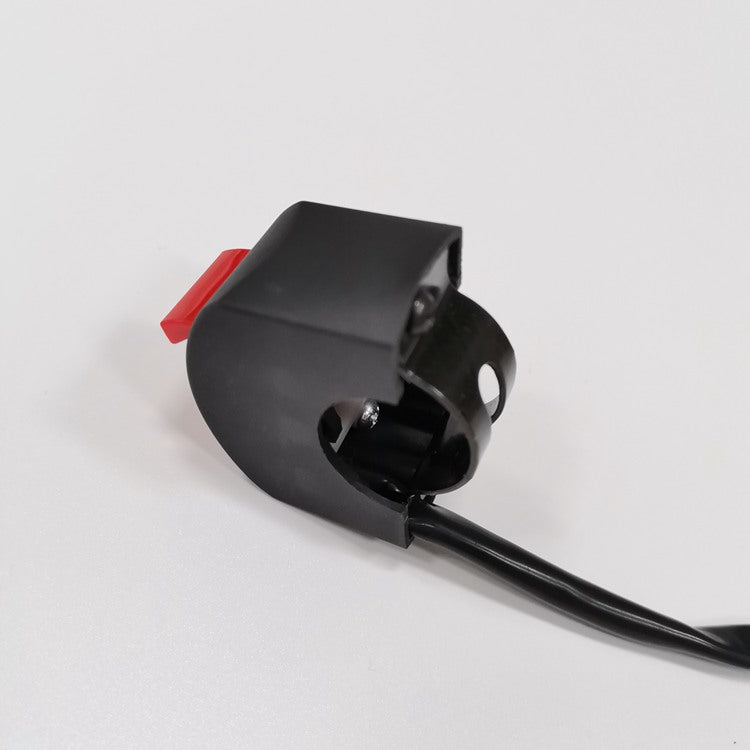 Black switch with red button on a white background
