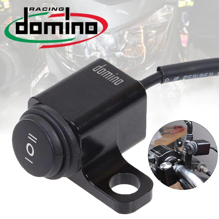 Motorcycle ignition switch with Domino Racing logo on a blurred background
