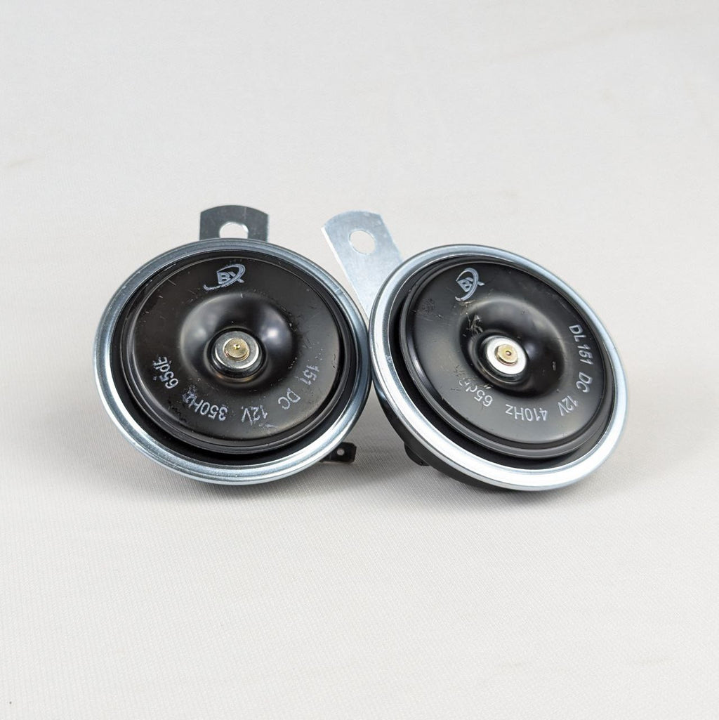 Two car speakers on a white background