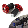 Red motorcycle handlebar risers on a white background
