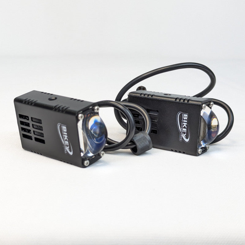 Two black bike lights with visible branding on a white background