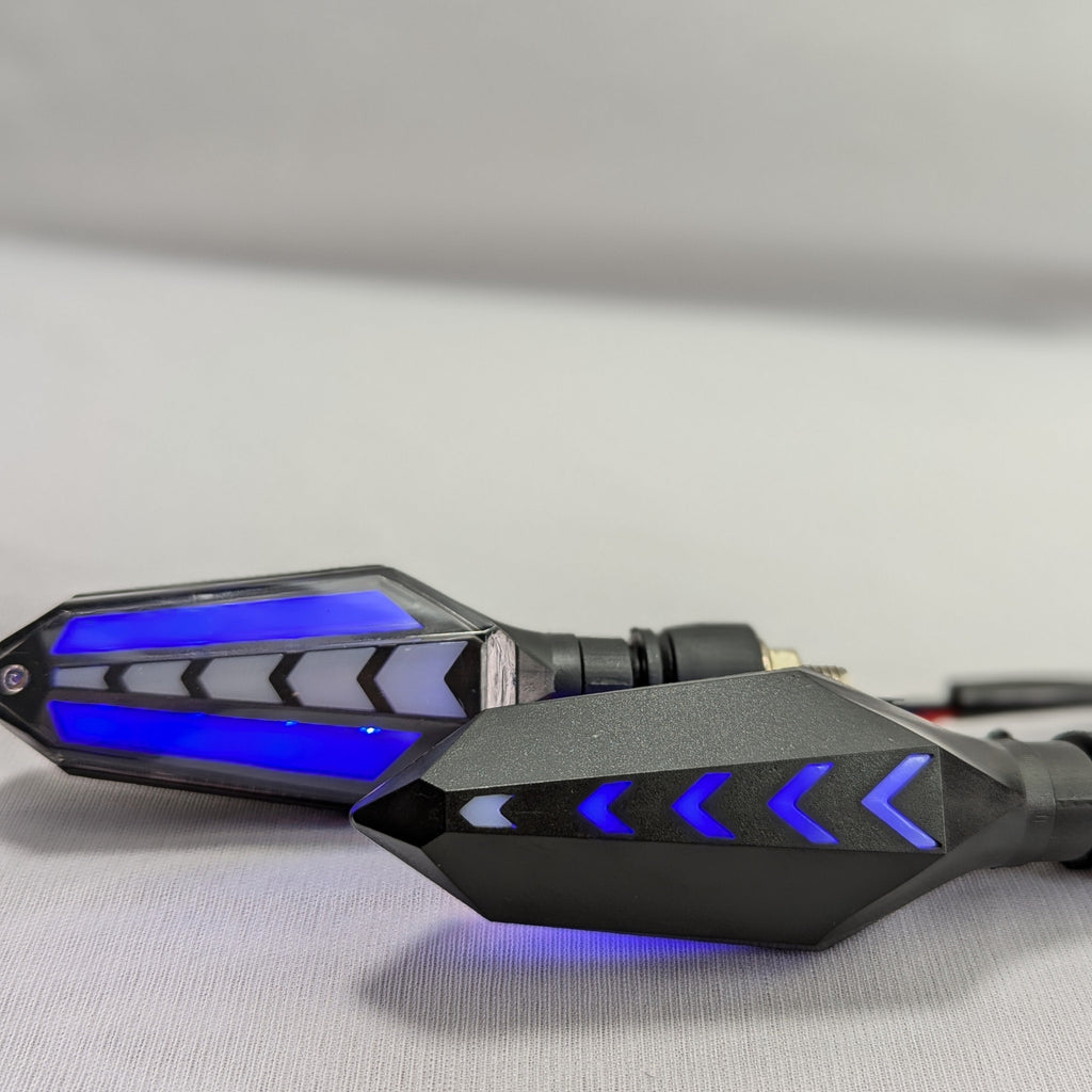Black motorcycle mirrors with blue LED lights on a gray background