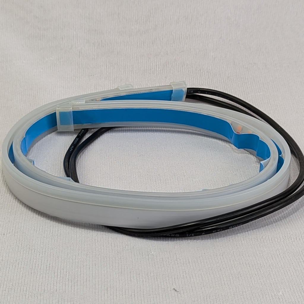 Clear silicone hose with blue interior lining and black cable on a light gray background