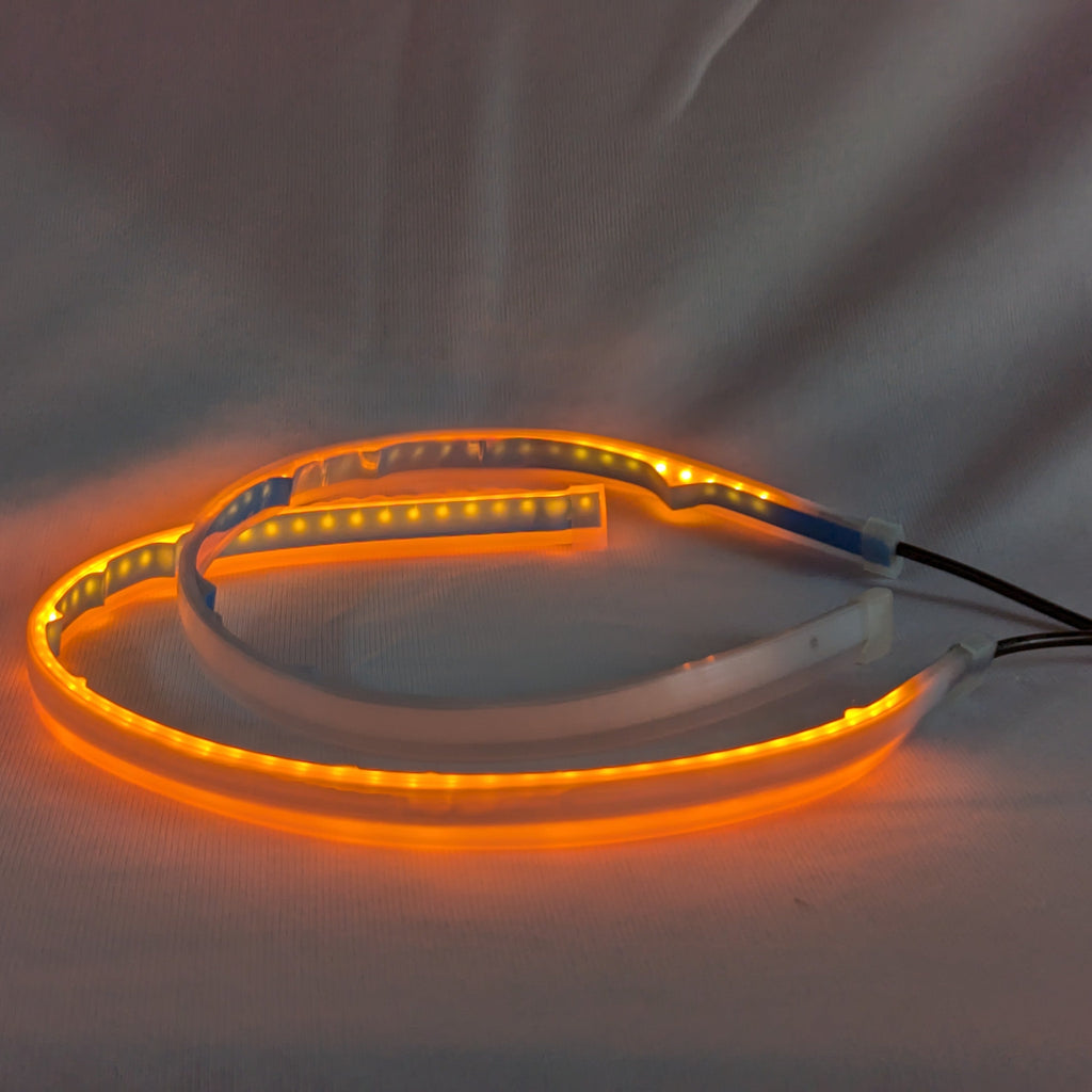 Orange LED strip light on a white background