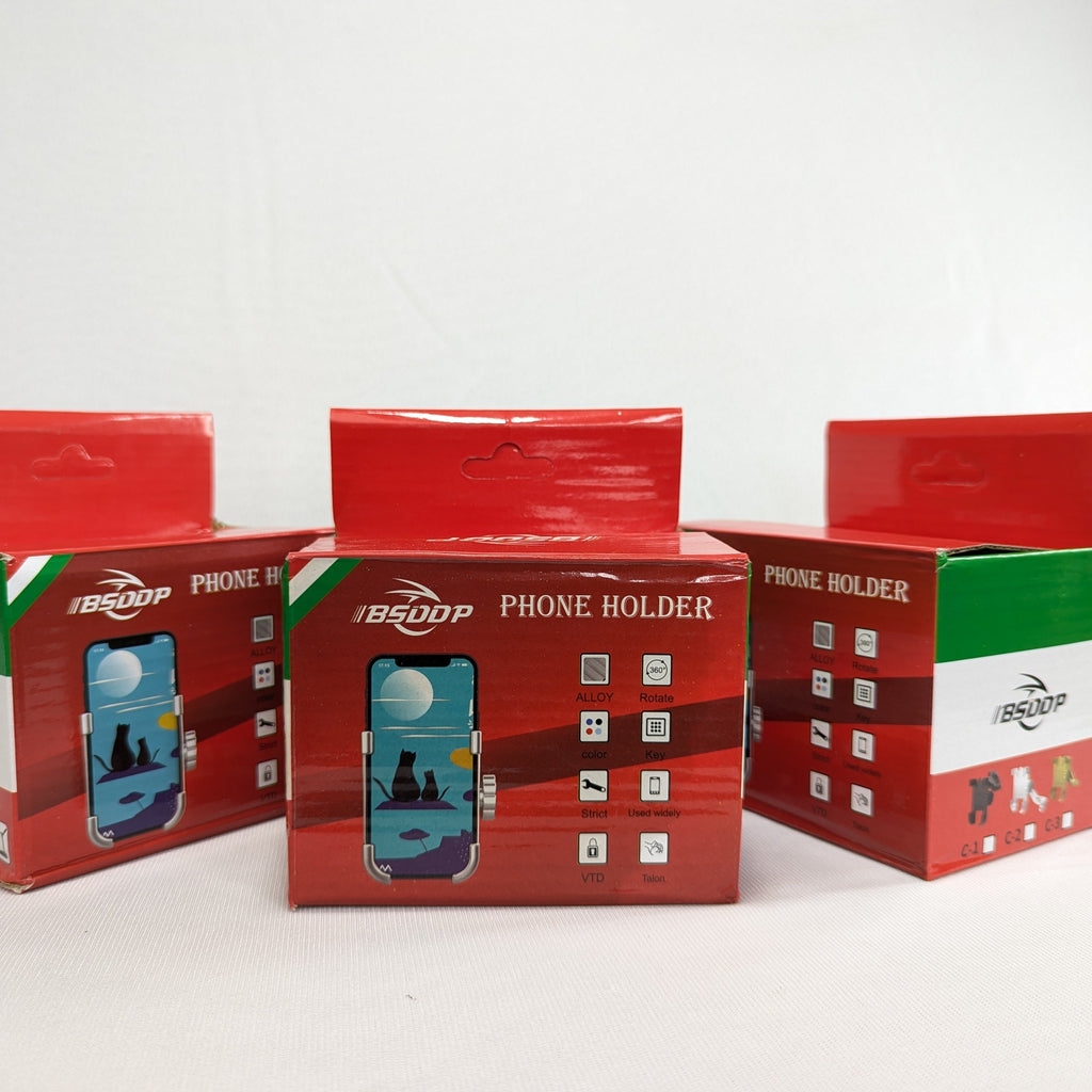 Three red and green boxes with phone holder branding on a white background