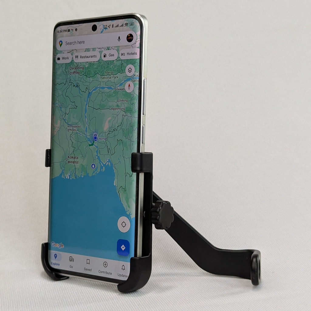 Phone mounted on a stand with a map app open on a white background