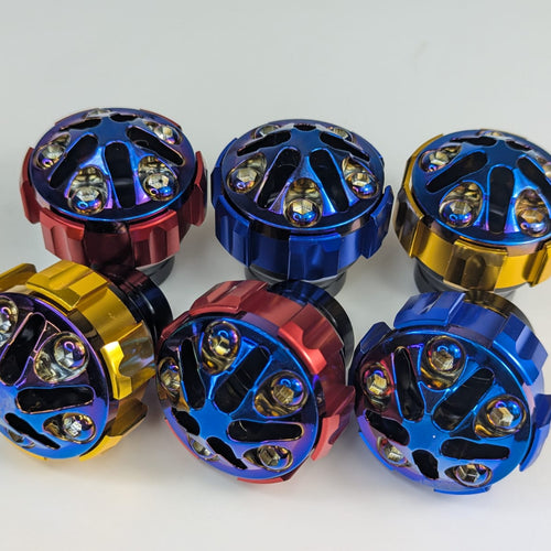 Set of colorful metal knobs on a white background